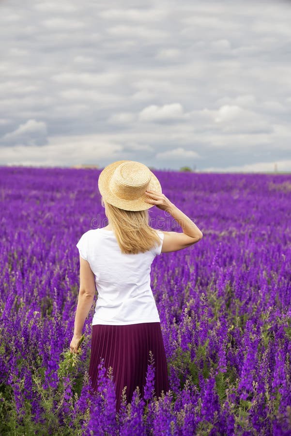 Standing upon the lilacs..
She stands upon the purple lilacs in a bewildered…