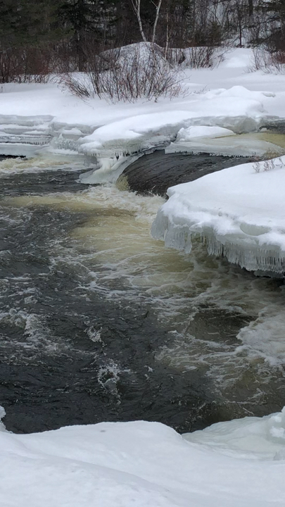 Peacefulness flows by from under the ice.
Roaring at me as it rushes bye.
All I…